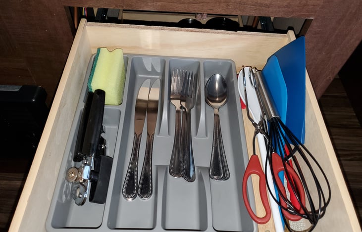 wine bottle opener :^), silverware, can opener, and misc cooking utensils