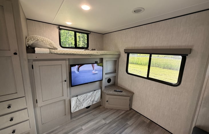 Additional bunk and amazing storage on other side of bunk house with entertainment center dedicated for the kids.