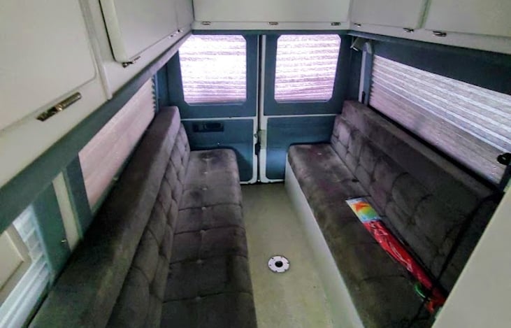 Bench seats have 3 seatbelts on each side (total seating for 8). Folds down into full-sized bed.