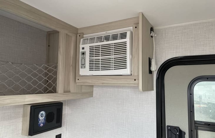 Powerful AC unit, ceiling fan and doors on both sides of the trailer keep the trailer cool.