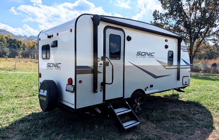 Easy-tow 2022 Venture Sonic Lite (3,600 lbs)! Features off-grid solar, all-terrain tires, slide-out, spacious rear kitchen, queen bed & power awning. Perfect couple's getaway for any adventure!