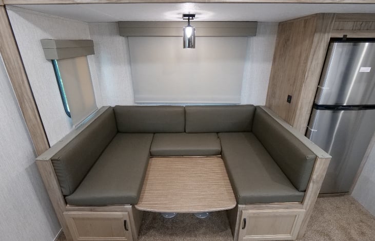 Dining table - converts into a bed - storage under seats