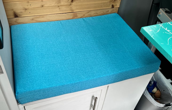 Three inch custom foam pad makes for a comfy bench for card games or meal time.