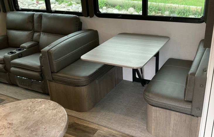 Dinette folds down for sleeping.  Recliners can also be used for sleeping.