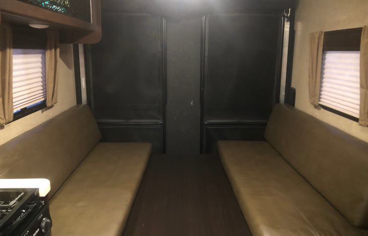 Dining table/seating in position to folding out into bed