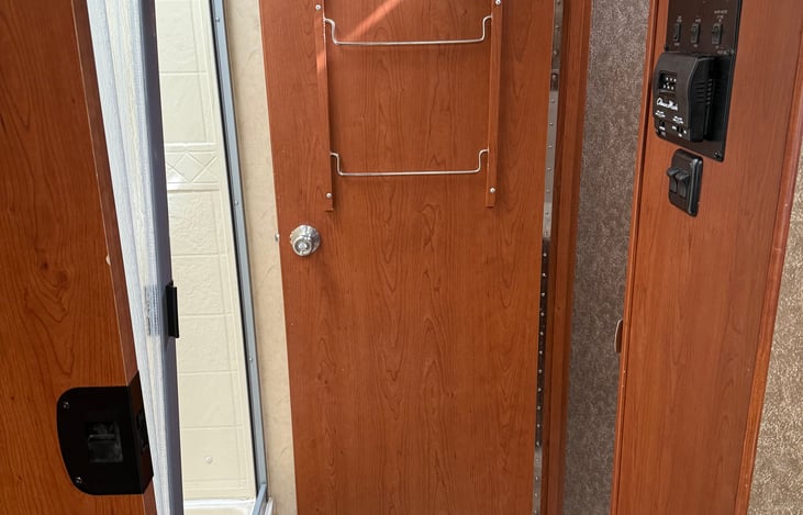 Bathroom and shower has dual privacy sliding and closing doors