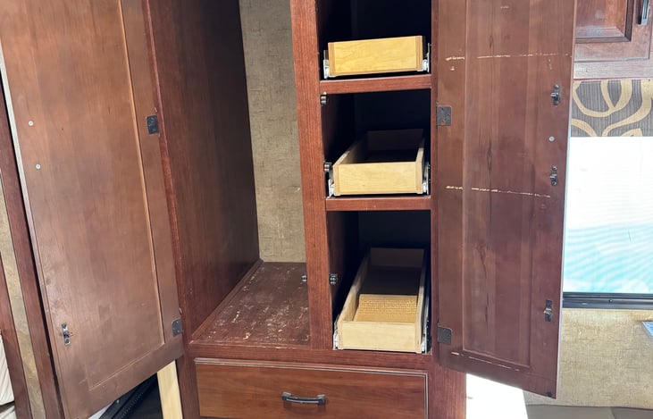 Clothes hanger and slide out drawers