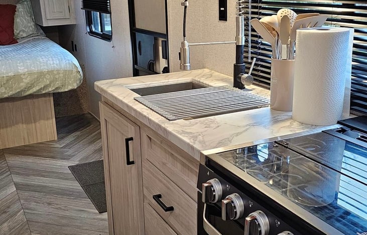 Paper products and cooking utensils are stocked