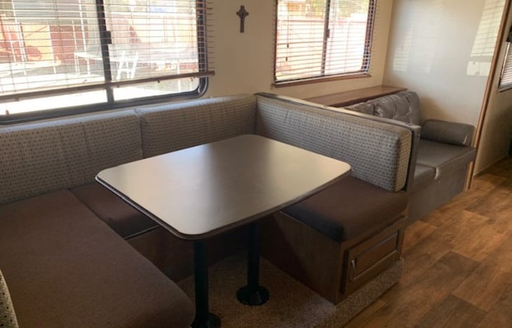 Dining room table and couch turn into beds.