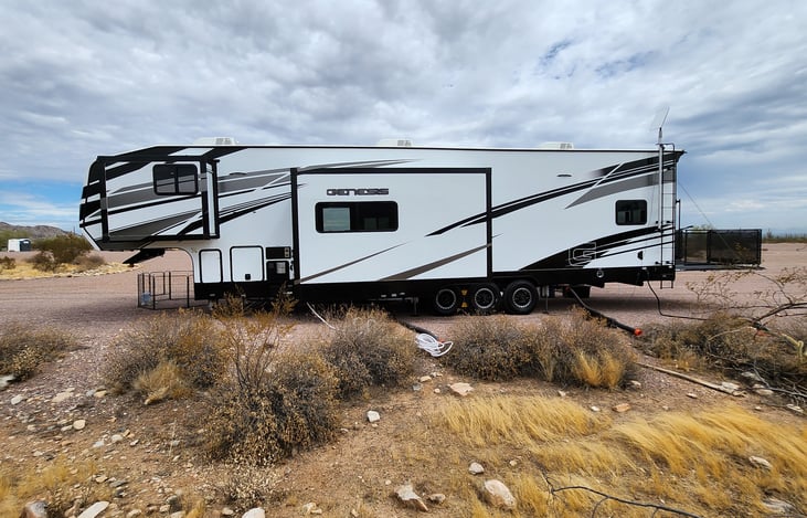 Non-camp side with 2 slides, hookups, StarLink internet dish, and back deck