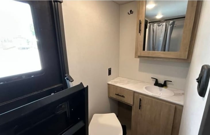 full bathroom at the end of the back of the camper