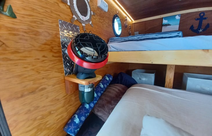 Little Buddy Heater and mount provided during colder weather. This trailer is very well insulated and you won't need a heater even in higher elevations during the summer.