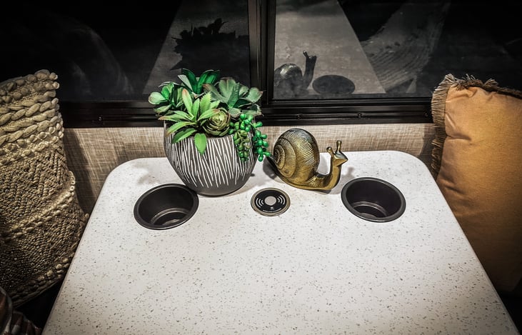 Dinette, cup holders and charging station. Converts to a bed.