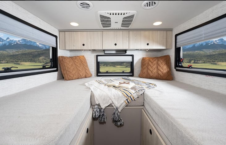 Love the bed arrangements with many drawers and cabinets below and overhead.