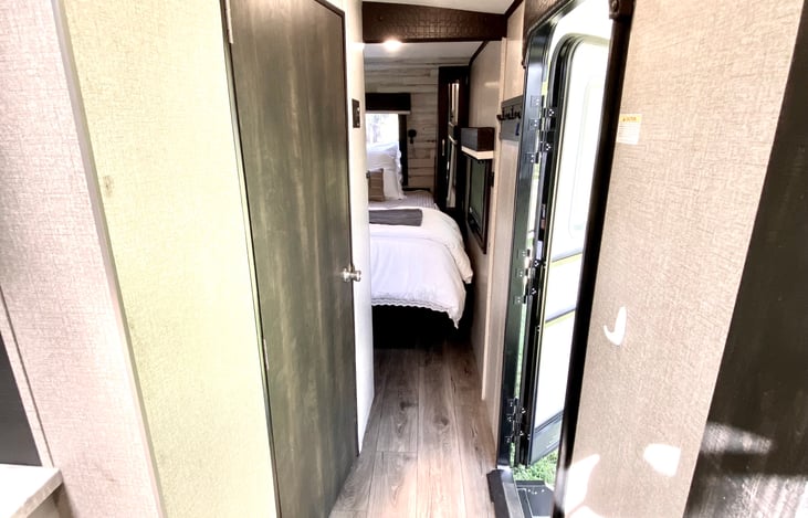 front entrance to trailer and hallway to master