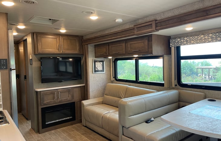 Main living area with electric fireplace/TV/seating for 8