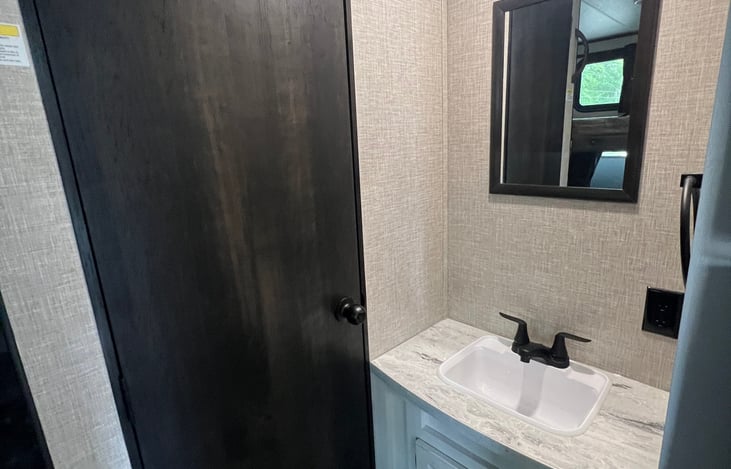 Separate sink area apart from bathroom