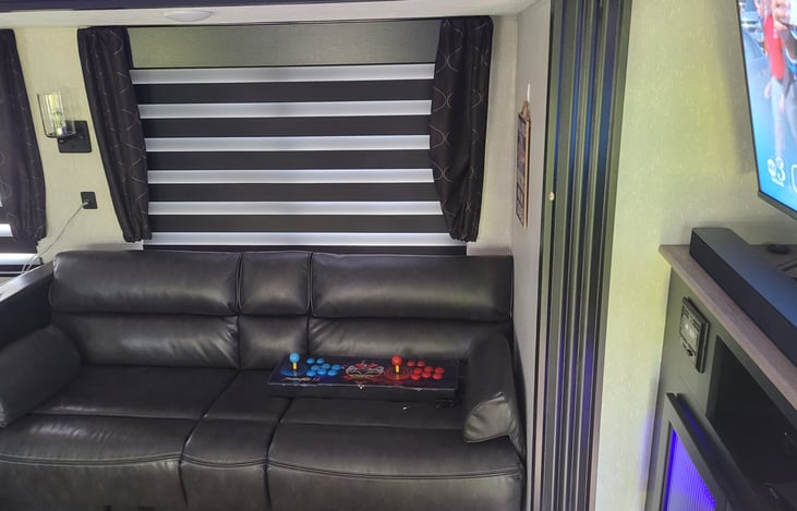 Foldout sofa is VERY comfortable! Retro gaming console shown here, too.