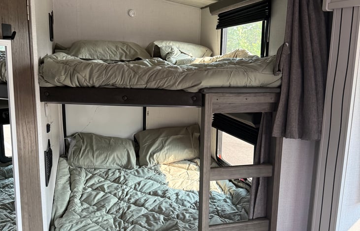Bunk beds easily fit 2 kids in each bed.