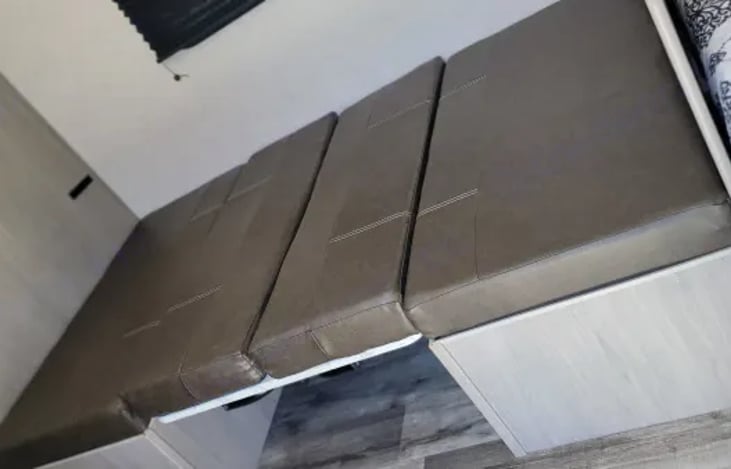 Dining table converted to a bed