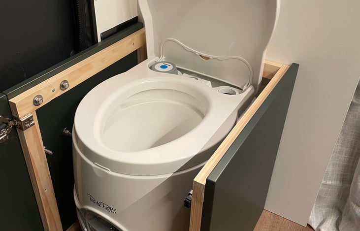 Cassette toilet under the bench seat