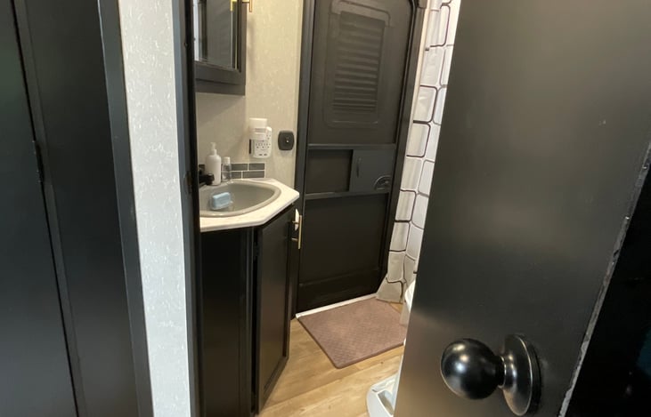 Rear entrance to the bathroom provides the ability to use the bathroom as a mudroom.