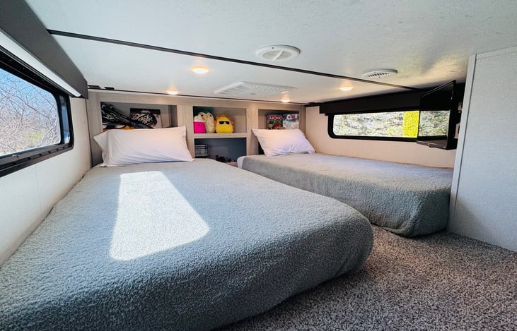 Loft with twin beds, Roku TV, and PlayStation 4.