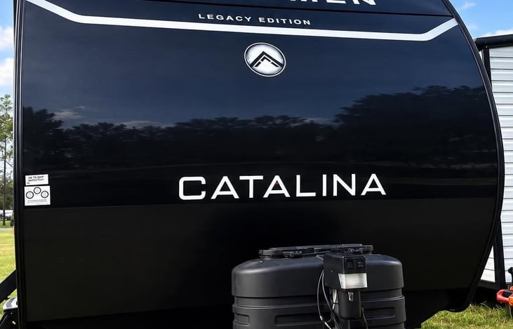 Front exterior view of our 2025 Coachmen Catalina Legacy Edition — clean, well-maintained and ready for your next adventure.