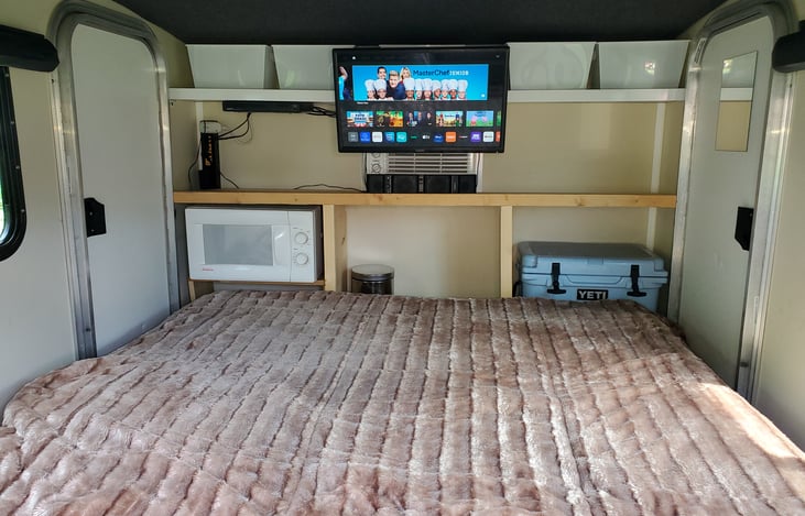 Microwave, YETI Cooler, and small trashcan