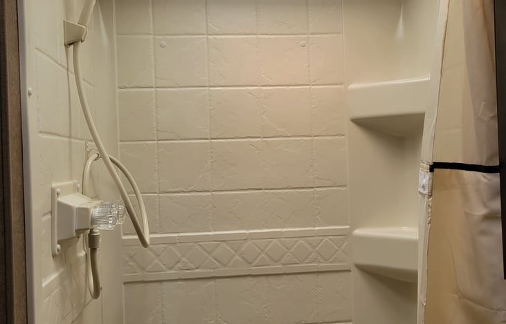 A shower that is better than no shower and if you are taller than 5'5" I am sorry...