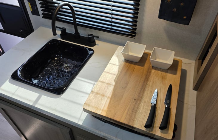 Cutting Board on top of stove burners for creative use of prep space.