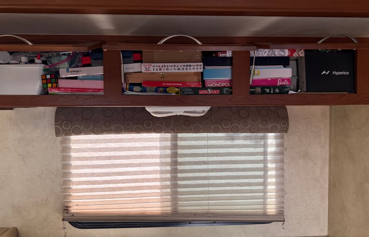 Plenty of storage above couch for games and whatever you choose