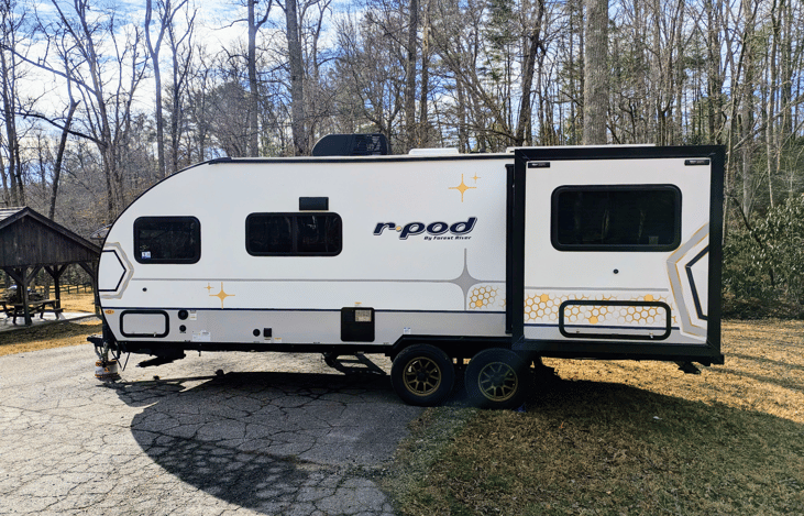 Experience luxury in this 2024 R-Pod 204! Loaded with modern amenities and technology, this whimsical camper features a walk-through bath, a queen-bed slide, on-demand water heater, solar power, inver