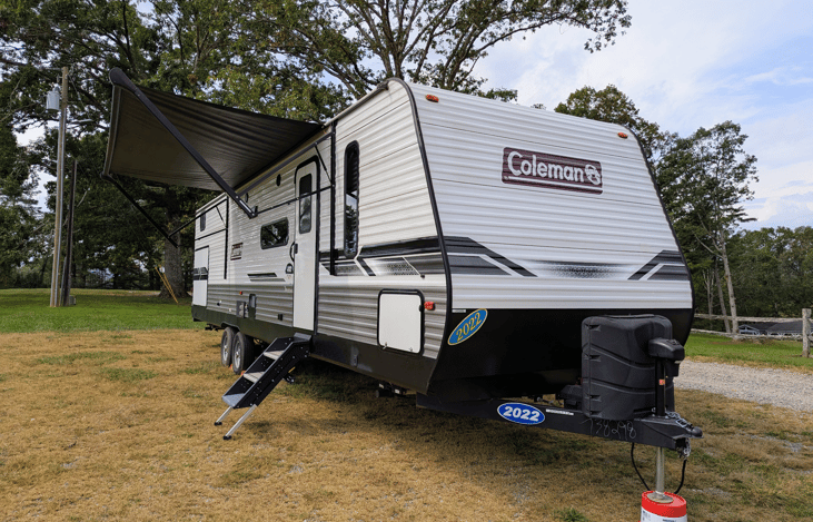 Family-friendly 2022 Coleman Lantern 334BH sleeps 9 w/ a private bunkhouse and 2 slide-outs. Modern, bright and spacious, features outdoor kitchen, large fridge, power awning, ample storage, and more.