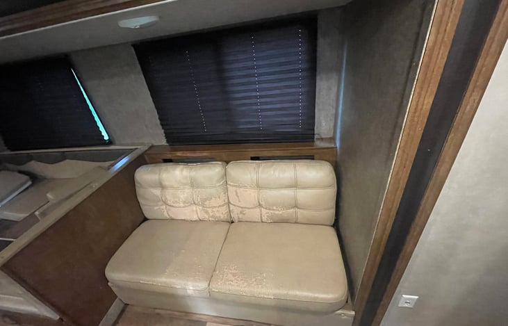 Small couch that converts to bed, 1 adult or two kids may sleep on this bed.