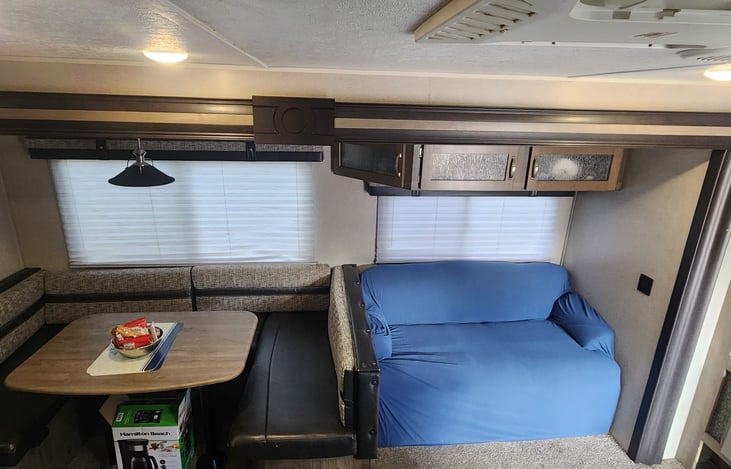 Couch that can be converted into more sleep space. Storage underneath couch.
