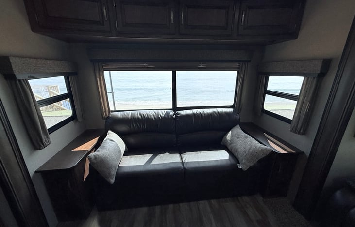 Jack-knife sofa bed will fold flat to sleep one or two. (Inflatable mattress for added sleep space (not shown)