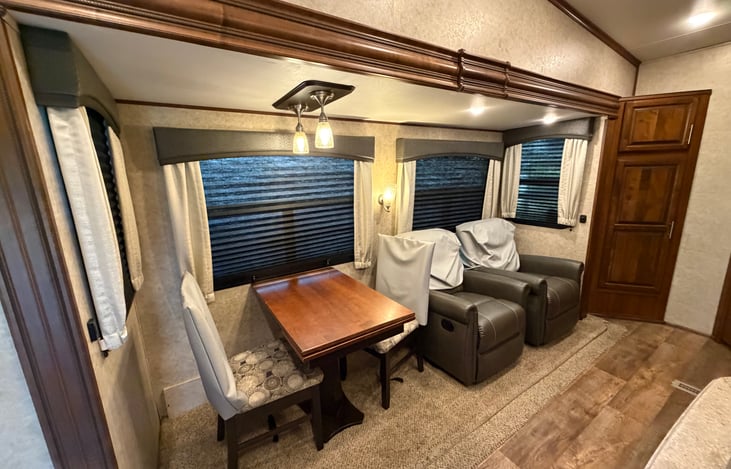 Dining/Living space with 2-4 dining chairs and 2 swivel/rocking recliners.