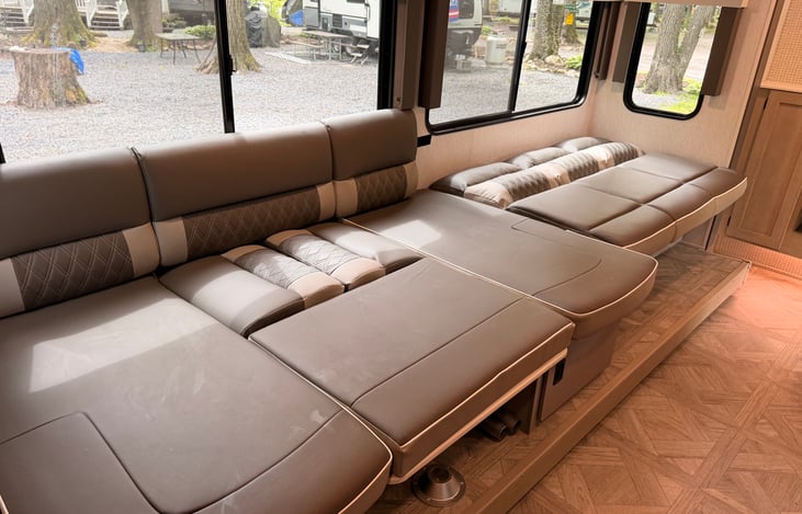 Versa lounge in the complete bed position. Couch pulls out and u shaped dinette turns into another bed as well