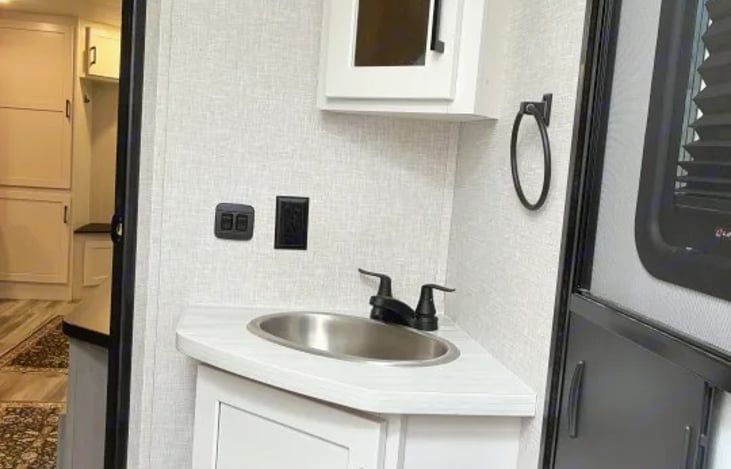 "Feathered Nest" provides a spacious shower paired with a skylight for extra headroom.