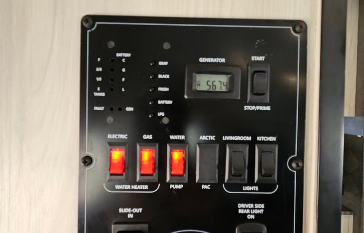 Black and white-water tank level display, generator usage hrs. display, main battery level display, power switches.