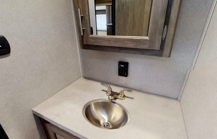 bathroom- also has a toilet and shower