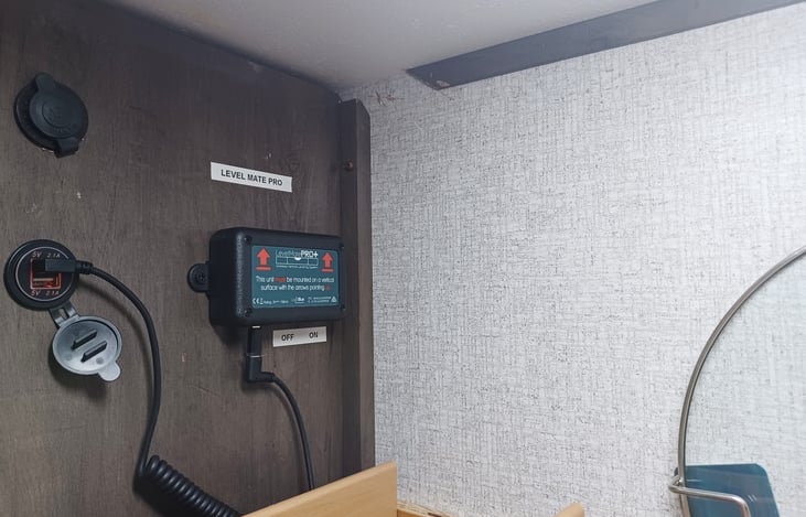 LevelMatePro installed inside the cabinet above the kitchen sink.