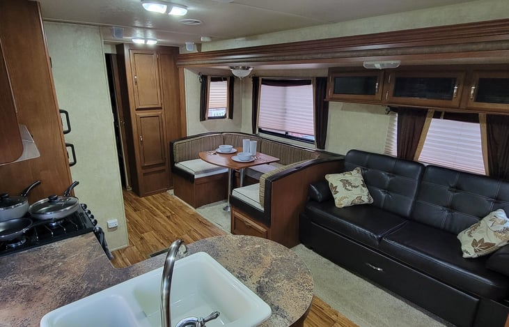 Main living area . Full dining table and couch folds into beds if needed more sleeping arrangements.