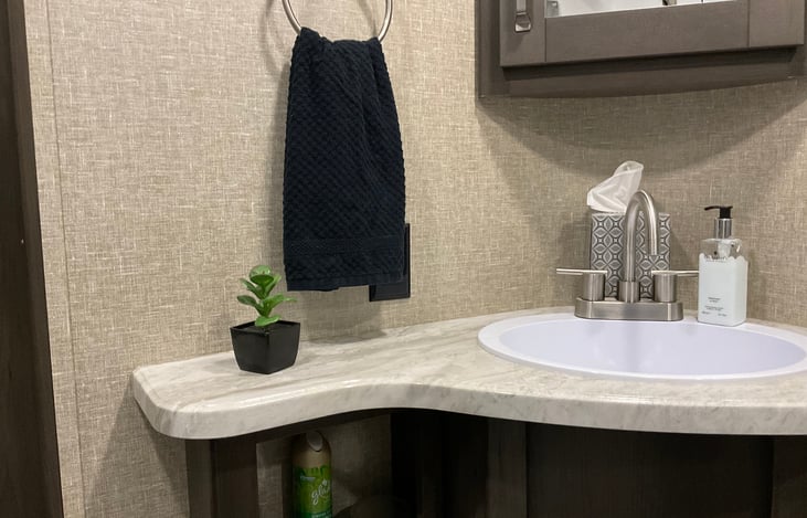 Bathroom vanity has all the necessities.