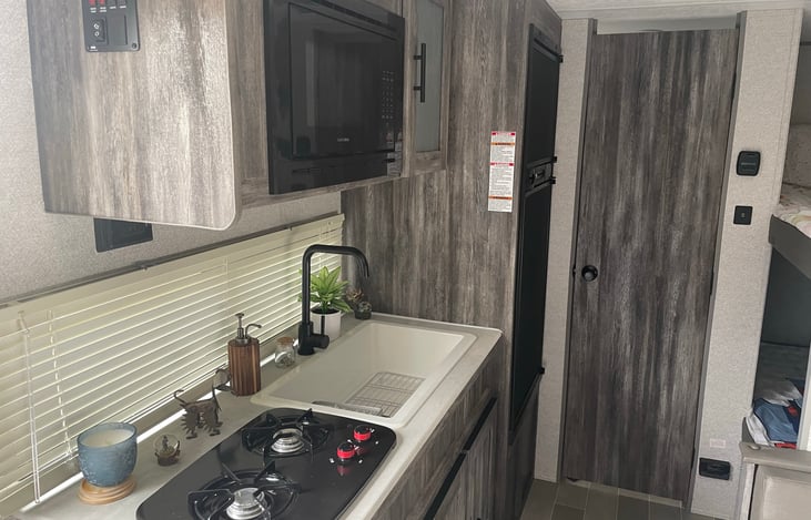 MICROWAVE AND STOVE W/2 BURNERS.