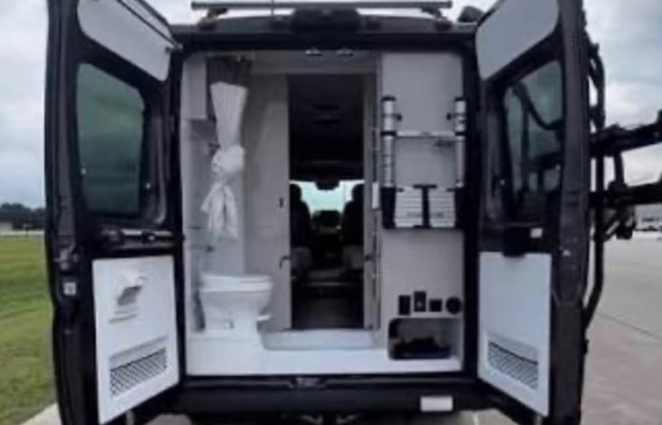 Shower, Toilet, sink, medicine cabinet with mirror, closet with drawers all in the back.