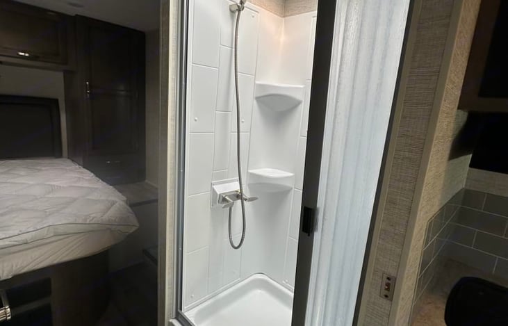 Split bath.  The toilet and sink are on the left, and the shower is on the right.  Privacy is provided by a pocket door and the bathroom door also opens up and can close the bedroom off.