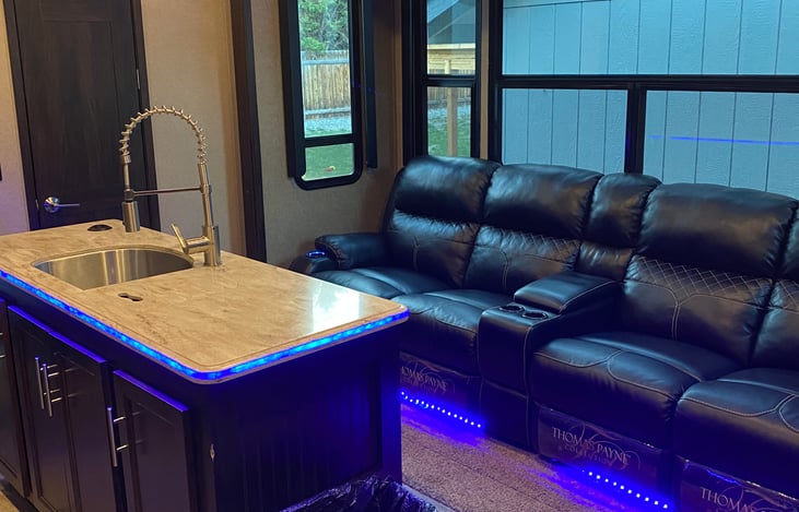 Main living area. Door allows access to partial bathroom.