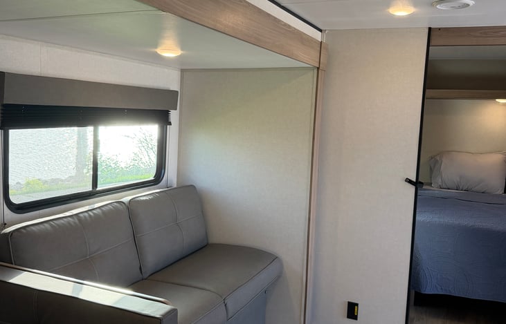 Comfortable dining dinette and living space—perfect for enjoying family meals, playing games, or relaxing after a day outdoors.